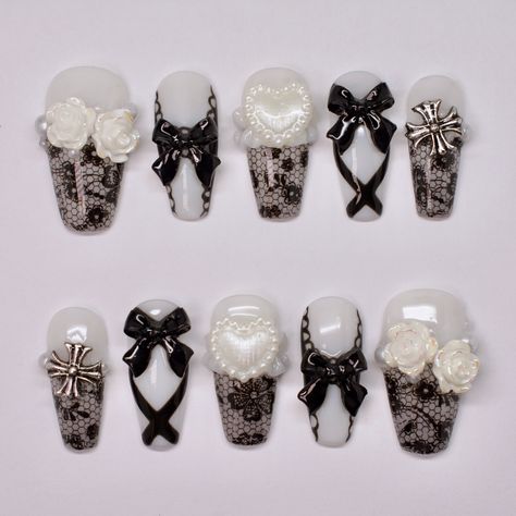 Gothic Bride ~Made to order~ Medium coffin nails, black lace, white ruffle sculpting, charms, nail art. Shop nails: celixxunails.com TikTok: Celixxu.nails Yt: CelixxuNails #nailartist #nailtech #beginnernailtech #beginnernailartist #pinterestnails #koreannailstyle #japanesenailart #y2knails #coquettenails #xiaohongshunails #gelxnails #pressonnails #douyinnails #smallbusiness #smallbusinessowners #nail #nails #nailart #naildesign #gelnails #gelpolish #gelnail #chromenails #auranails Coffin Nails Black, Medium Coffin Nails, White Lace Nails, Lace Nail Art, Gothic Bride, Medium Coffin, Punk Nails, Gothic Nails, Lace Nails