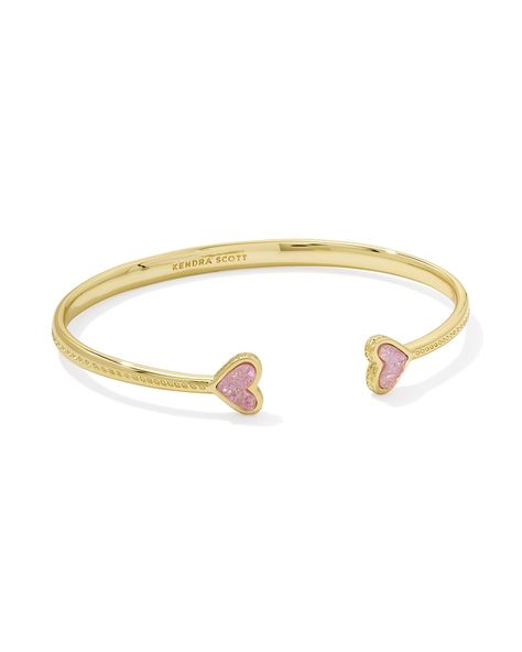 We’re crushin’ on our sweetest icon, and with the Framed Ari Heart Gold Cuff Bracelet in Light Pink Drusy, you can clearly see why! Made to be adjustable for a perfect fit, this cuff is bookended by two darling heart stones in a sleek metal frame, embellished with our signature hoofprint detailing for that extra KS touch. Metal 14k Yellow Gold Over Brass Material Light Pink Drusy Closure Adjustable Size 2.28" Inner Diameter, 0.34"L X 0.3"W StationsDue to the one-of-a-kind nature of the medium, e Bf Gf Matching Jewelry, Kendra Scott Heart Bracelet, Gold Kendra Scott Earrings, Real Gold Bracelets, Christmas Gifts For Mom From Daughter To Buy, Kendra Scott Christmas, Pink Christmas Gift Ideas, Pink And Gold Bracelet, Cheap Boyfriend Gifts