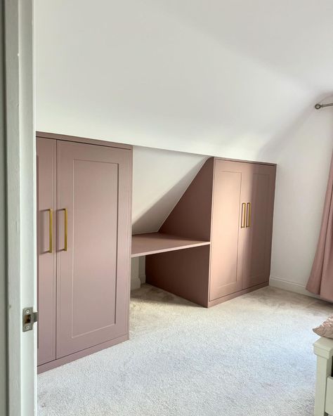 IKEA PAX Customisation | Maximizing every nook and cranny with style! Our IKEA PAX fitted wardrobe with dusky pink custom doors fits perfectly under the eaves. ✨ … | Instagram Bedroom Eaves Ideas, Ikea Pax Hack Slanted Ceiling, Loft Eaves Wardrobe, Dormer Built In Wardrobe, Attic Wardrobe Ideas Sloped Ceiling Built Ins, Closet In Eaves, Wardrobes In Eaves, Under Eaves Storage Sliding Doors, Wardrobe Nook Ideas