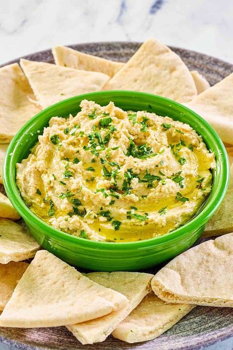 Experience the smooth and creamy delight of homemade hummus with Greek yogurt! This rich and flavorful dip pairs the earthy taste of chickpeas with the tangy freshness of yogurt, resulting in a spread that's perfect for pita bread, chips, and veggies. Get the easy recipe and find out how to make creamy hummus with Greek yogurt. It’s packed with protein and a healthy, satisfying snack. Enjoy the velvety texture and zesty flavors that will make your taste buds dance. Pita Bread Chips, Creamy Hummus Recipe, Bread Chips, Easy Hummus Recipe, Make Greek Yogurt, Creamy Hummus, Homemade Appetizer, Beet Hummus, Easy Hummus