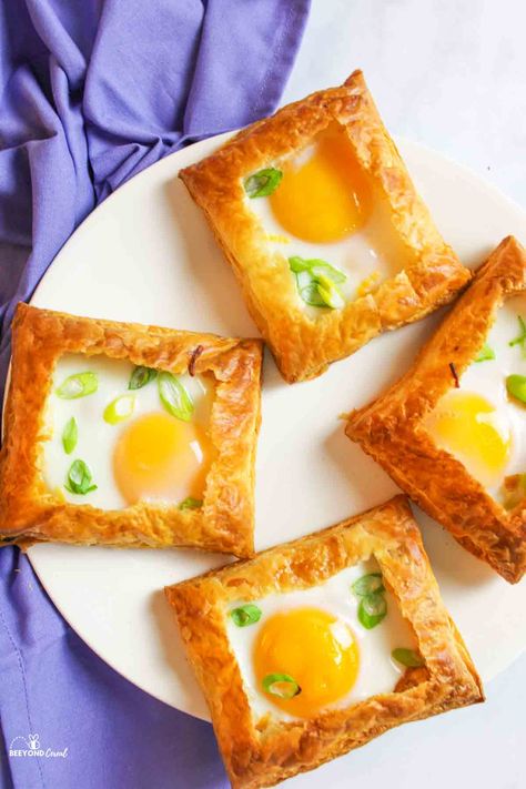 This puff pastry egg tart recipe is perfect for breakfast and brunch! An easy recipe with little prep and minimal ingredients is always a welcomed treat in the morning! These flaky egg tarts are absolutely perfect. They not only look good but taste good as well. With a soft set yolk, perfectly cooked egg whites, and a flakey buttery crust in every bite, it's too good to resist. Puff Pastry Breakfast, Pastry Breakfast, Egg Tart Recipe, Easy Puff Pastry Recipe, Cheese Puff Pastry, Easy Puff Pastry, Cheese Pastry, Over Easy Eggs, Breakfast And Brunch