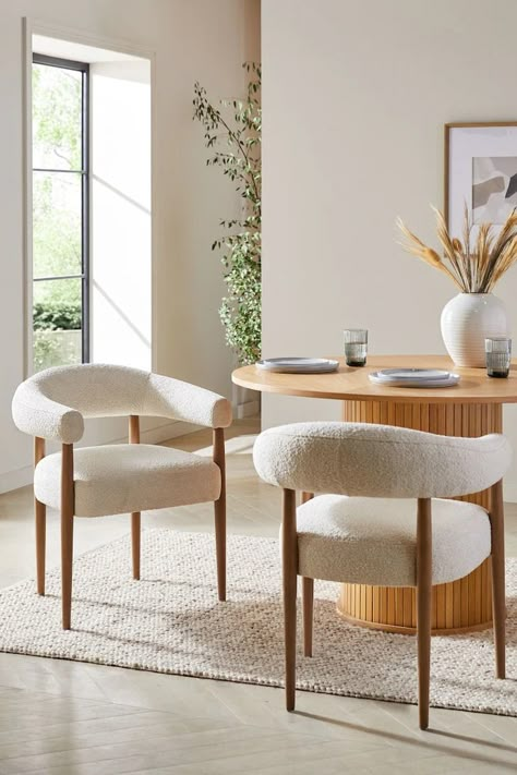 Buy Set of 2 Casual Boucle Oyster Aire Light Wood Leg Dining Chairs from the Next UK online shop Round Table Decor Kitchen, Cosy Dining Table, Round Dining Table Chairs, Kitchen Dining Area Ideas, Boucle Chair Dining, Kitchen Sitting Area Ideas, Round Dining Table With Chairs, Dining Set Ideas, Round Table With Chairs