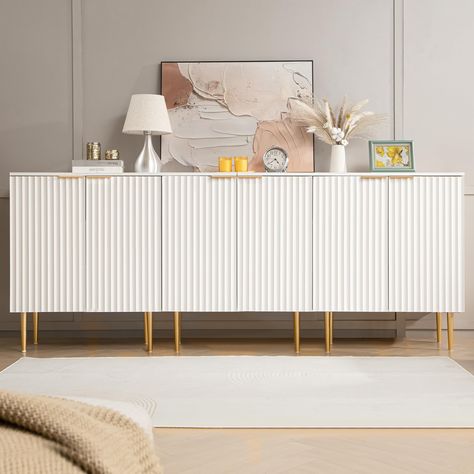 PRICES MAY VARY. 【Upscale Minimalist Design】With its modish Scandinavian fluted elements and white spray-painted finish, this sideboard seamlessly blends style and functionality, making it a versatile addition to any home decor. 【Practical Features】With 6 level adjustable shelves, a weight capacity of 55 lbs for the interior, and 66 lbs for the top surface, this buffet cabinet provides ample storage space for all your cherished items. 【Durable Material】The spray-painted finish surface is easily Wooden Credenza, Wood Sideboard Buffet, White Storage Cabinet, Dining Room Navy, Living Room Cupboards, White Sideboard Buffet, Mini Mansion, Hair Room, Console Table With Storage