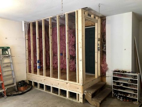 When we moved we knew we needed to improve the mudroom situation. There was just nowhere to hang up all of the jackets and keep all of the shoes. So, after spending lots of time trying to come up with how to gain space in our house for a mudroom, we decided to utilize garage space and build an enclosed mudroom. Here is our mudroom transformation to give you some ideas and inspiration for your own DIY mudroom. Mudroom Ideas In Garage, Mudroom With Steps, Small Mudroom Garage Entry, Creating A Mudroom In Garage, Add Mudroom To Front Of House, Garage Landing Ideas Entryway, Diy Room In Garage, Entryway In Garage, Porch Into Mud Room