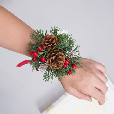 christmas corsages - Google Search Christmas Corsage Wedding, Christmas Wrist Corsage, Winter Wedding Corsage, Winter Boutineer Groomsmen, Wedding Anniversary Dinner Party, Anniversary Dinner Party, Wedding Anniversary Dinner, Winter Boutonniere, Christmas Corsage