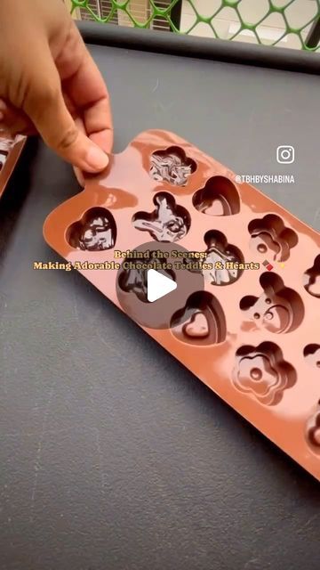 The Baker’s Hub by Shabina on Instagram: "🎥 Ever wondered how our cute fruit & nut chocolate teddy bears and heart-shaped dark chocolates are made? 

🍫✨ Watch this BTS to see the magic unfold! ✨✨ If you love chocolate, hit the ❤️ button, comment your favorite chocolate emoji, and share this reel with fellow chocolate lovers! 🍫💖 

#ChocolateLovers #BTS #DessertMaking #FoodieLife #SweetTreats #ViralReels #FoodieHeaven #ChocolateArt #BehindTheScenes #yummy" Chocolate Emoji, Teddy Bear Chocolate, Chocolate Art, Cute Fruit, Love Chocolate, Chocolate Lovers, Teddy Bears, Dark Chocolate, Chocolates