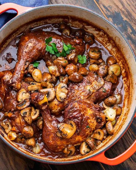 Coq au Vin is a rich and hearty French stew of chicken that's braised until tender in red wine with vegetables and herbs, then finished with mushrooms and pearl onions sauteed in butter. Coq au Vin is perfect served with crusty bread or with mashed potatoes. #coqauvin #frenchcuisine #stewrecipes #chickenrecipes Coq Au Vin Aesthetic, Coque Au Vin Recipe, Chicken Provencal Recipes, Cog Au Vin, French Stew, Dumplin Recipe, Coq Au Vin Recipe, Sip And Feast, Weekend Recipe