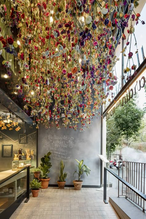 A famous name scores with another winner at Barcelona's new ode to the contentedness of village living... Flower Cafe, Flower Ceiling, Coffee Shop Interior Design, Decoration Restaurant, Rustic Cabinets, Plafond Design, Coffee Shops Interior, 카페 인테리어 디자인, Coffee Shop Design