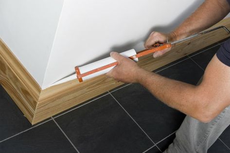 Follow these easy steps for how to caulk baseboards, and the next walls you paint will look like they've been done by professionals. Boards On Walls, Caulk Baseboards, Caulking Tips, Concrete Walls, Diy Accent Wall, Easter Basket Diy, Skirting Boards, Professional Decor, Diy Furniture Easy