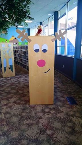 Christmas Decor Ideas In Library, Christmas Decor Ideas For Library, Reading Christmas Bulletin Boards, Christmas Decorations For Library, Christmas Display Library, School Library Christmas Decorations, Library Drop Box Ideas, Library Winter Decorations, Christmas Library Door Ideas