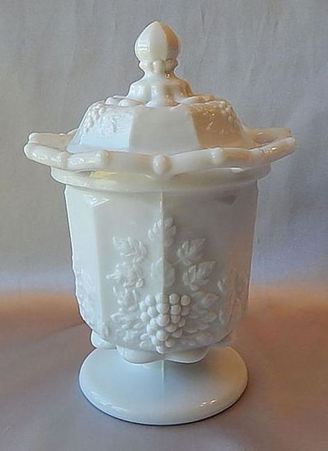 Is that white glassware Westmoreland's popular Paneled Grape milk glass? See an example and learn more about it here. Milk Glass Decor, Antique Vintage Decor, Milk Glass Collection, Westmoreland Glass, Antique Dishes, Antique Glassware, Vintage Bottles, Fenton Glass, White Milk Glass