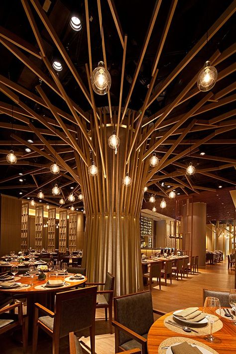 middle of restaurant Radial Design Interior, Innovative Retail Design, Restaurant Pillar Design, Restaurant Wood Design, Interior Tree Design, Radial Interior Design, Radiation Interior Design, Radial Balance Interior Design, Wood Restaurant Design