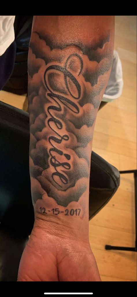 Mens Cloud Tattoos, Name And Clouds Tattoo, Name In Clouds Tattoo, Medium Men Tattoo Ideas, Rip Grandma Tattoos For Men Arm, Forearm Tattoos Names Men, Rip Tattoos For Men Small, Rip Arm Tattoo Men, Clouds Around Name Tattoo