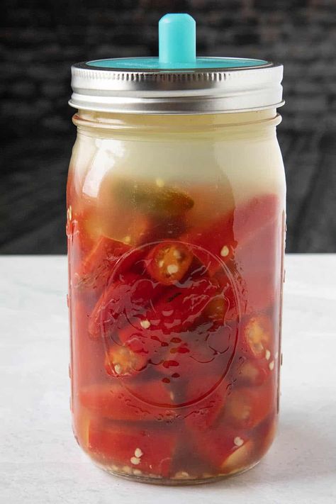 Fermented Hot Sauce Recipe - I grew loads of peppers in my garden this year just so I could make this fermented hot sauce recipe. It is wonderfully spicy and big on flavor. Drizzle it over anything. Works for any type of peppers. #HotSauce #Serranos #SpicyFood Fermented Ghost Pepper Hot Sauce Recipe, Fermenting Hot Peppers, Fermented Tabasco Sauce, Fermented Cayenne Peppers, Fermented Cayenne Pepper Sauce, Fermented Serrano Hot Sauce, Fermented Hot Sauce Recipe Homemade, Trinidad Scorpion Pepper Hot Sauce, Fermented Hot Peppers