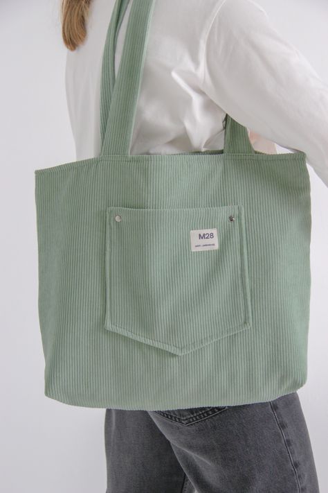 This bag handmade with love in SaintPetersburg!Basic design is perfect choice for everyday&casual outfits. There is one pocket outside the bag for small items as keys, cards, smartphone and so on.Size: 36x45 cm, handles 70 cmMaterial of top: corduroy polyesterColour: mint