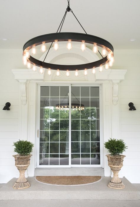 Boxwoods flanking front door with giant outdoor chandelier Front Porch Lighting Fixtures, Outdoor Entryway Ideas, Outside Porch Lights, Hanging Porch Lights, Outdoor Porch Lights, Porch Light Fixtures, Front Porch Lighting, Porch Lights, Outdoor Entryway