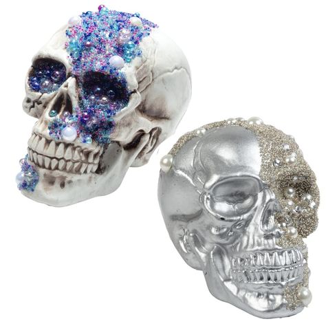 PRICES MAY VARY. Includes 2 Gem Studded Skulls (Measures 8" x 5.5") Comes with one silver skull decorated with pearl colored accents and one white skull covered with multi colored purple, blue, white, and cobalt gems. Crafted with attention to detail, these skulls feature realistic human head sculptures and are adorned with eye-catching rhinestones for an extra dose of creepiness- perfect for indoor or outdoor use! Turn your home into a haunted mansion or pirate's treasure trove - great for deco Fall Party Decor, Table Statue, Rhinestone Halloween, Silver Pumpkins, Skull Statue, Rustic Table Decor, Elegant Halloween, Chic Halloween, Glitter Pumpkins