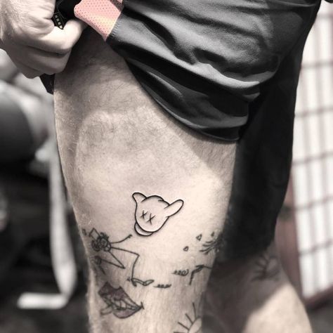 Mickey Mouse hand tattoo on the left thigh. Mickey Mouse Hands Tattoo, Mickey Mouse Tattoo For Men, Mickey Hands Tattoo, Badass Tattoos For Men, Dragon Thigh Tattoo, Leg Tattoos For Men, Thigh Tattoo Quotes, Mickey Tattoo, Thigh Tattoo Men