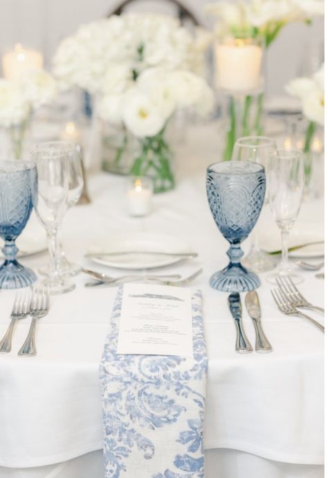 Blue And White Wedding Dessert Table, Blue Glasses Wedding Table, Blue And White Macarons, Blue And White Wedding Round Table Decor, Wedding Flowers Summer Centerpieces, Blue Floral Napkins Wedding, White Wedding With Hints Of Blue, Blue And White Wedding Table Settings, Navy Blue And White Table Setting