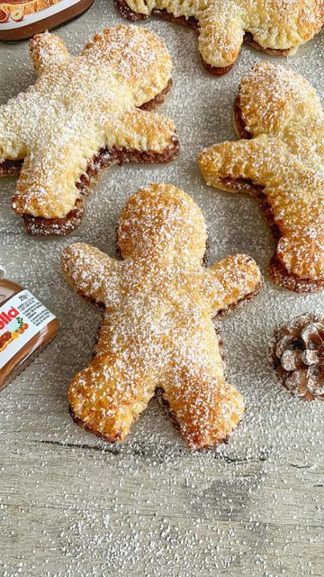 Nutella Christmas Star Puff Pastry, Nutella Stuffed Pastry Gingerbread, Nutella Stuffed Gingerbread Men, Nutella Stuffed Pastry Gingerbread Men, Christmas Nutella Pastry, Christmas Desserts Pastry, Nutella Puff Pastry Gingerbread Men, Nutella Gingerbread Men, Nutella Stuffed Puff Pastry