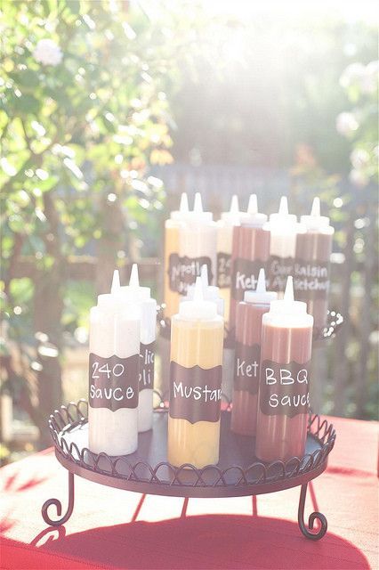 Great idea for my bbq reception. Will probably just write with a black marker the sauce name. Backyard Bbq Wedding Reception, Bbq Wedding Reception, Backyard Bbq Wedding, Bbq Buffet, Gourmet Hot Dogs, Backyard Bbq Party, Fest Mad, Hot Dog Bar, Sandwich Bar