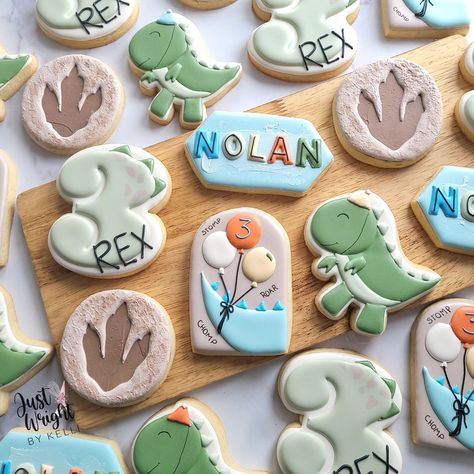 Stomp, Chomp, Roar! 🦖 Nolan's a THREE-REX and ready to party like a dinosaur with his playful birthday cookies. Happy Birthday Buddy. #threerex #birthdaysugarcookies #decoratedsugarcookies #t-rex #birthdaytreats #royalicingcookies #sugarcookiesofnstagram #balloons #dinoprint #letsparty #stompchomproar #southernNH Dinosaur Birthday Theme, Dinosaur Birthday Party Decorations, Royal Iced Cookies, Boys First Birthday Party Ideas, Dinosaur Cookies, Dinosaur Themed Birthday Party, Dino Birthday Party, Dinosaur Theme Party, Baby Boy 1st Birthday