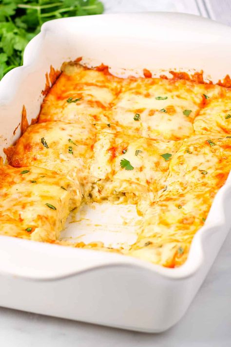 Easy Chicken Enchilada Casserole is the best comfort food! In this simple layered version of chicken enchiladas, creamy chicken is spread over corn tortillas, covered in green chile sauce, and topped with cheesy goodness! A warm, hearty meal that's quick to make and perfect for the whole family! Green Chili Chicken Enchilada Casserole, Enchiladas Creamy, Crockpot Chicken Casserole, Family Casserole, Shredded Chicken Casserole, Green Chili Chicken Enchiladas, Creamy Enchilada, Easy Chicken Enchilada Casserole, Green Chicken Enchiladas