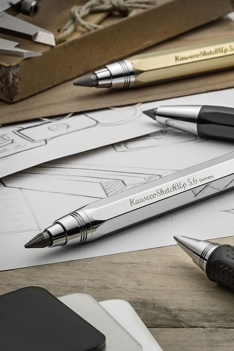 A range of Kaweco mechanical drawing pencils are laid out on a table with engineering sketches. The pencils are in gold, silver and black. Mechanical Pencils Aesthetic, Pencils Aesthetic, Drawing Gifts, Mechanical Drawing, Perfect Drawing, Gifts For Artists, Drafting Pencil, Drawing Pencil, Graphite Pencils