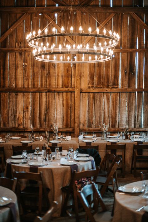 Love this #rustic barn chandelier in this Loudoun County #weddingvenue. http://www.bakerture.com Barn Chandelier Ideas, Large Rustic Chandelier High Ceilings, Farm Hanging Lights, Western Houses, Chandelier In Barn, Barn Chandelier, Chandelier In Barn Wedding, Barn Aesthetic, Vintage Chandelier That Compliments Barn Light Pendants