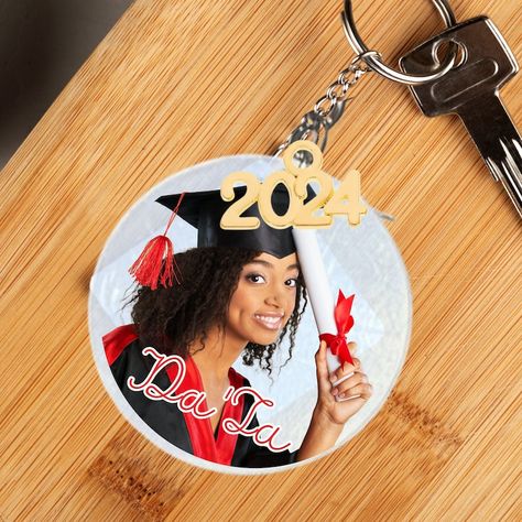 #graduate #giftforgrad #seniorgraduation #graduationphoto #seniorphoto #photogifts #personalizedgifts #2024graduation #photokeychain #2025graduate #seniornight  Our UV printed Graduation Photo keychain makes a great gift or commemorative party favor at your graduation party or senior night! Year charm in your choice of 3 platings is included. Personalized Key Chain comes in three sizes, 2, 3, & 4". Graduation Gift Basket, Personalized Key Chain, Senior Night Gifts, Graduation Picture, Ornament Design, Gift Photo, Senior Graduation, Photo Keychain, Graduation Photo