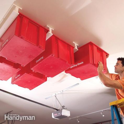 Create a Sliding Storage System On the Garage Ceiling - Summary: The Family Handyman Garage Ceiling Storage, Overhead Garage Storage, Overhead Garage, Garage Storage Systems, Ceiling Storage, Overhead Storage, Ideas Para Organizar, Diy Casa, Viria