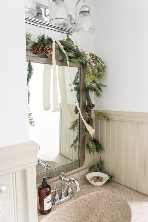 Christmas Bathroom Ideas, Thrifty Christmas, Christmas Mirror, Cedar Wreath, Christmas Bathroom Decor, Decorating Bathroom, Christmas Bathroom, Small Wreaths, Simple Christmas Decor