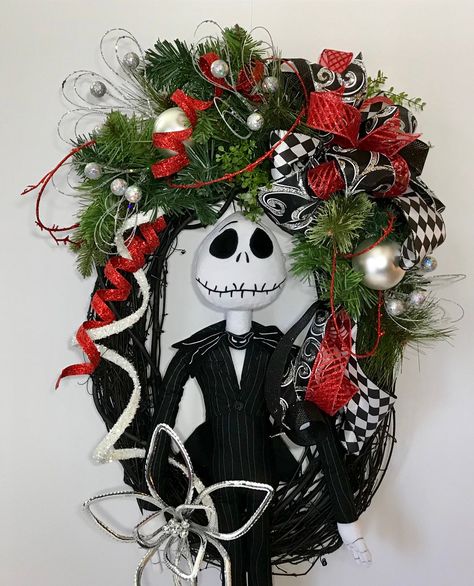 "Jack Skellington Nightmare Before Christmas Wreath, Black Oval Grapevine Jack Wreath, Front Door Xmas Halloween Wreath, Holiday Decoration Check out this awesome Jack Skellington wreath! Up for sale is a Nightmare Before Christmas black oval grapevine wreath. featuring a plush 28\" tall Jack Skellington stuffed doll. This wreath has Christmas evergreen, red and white ribbon streamers, silver ornaments, silver glitter small ornament spikes & so much more. Jack is holding a stylized, silver p Nightmare Before Christmas Christmas Wreath, Jack Skellington Wreath Diy, Jack Skellington Christmas Decorations, Nightmare Before Christmas Tree Ideas, Christmas Grapevine Wreath Ideas, Jack Skellington Christmas Tree, Character Wreaths, Christmas Wreath Black, Jack Skellington Wreath