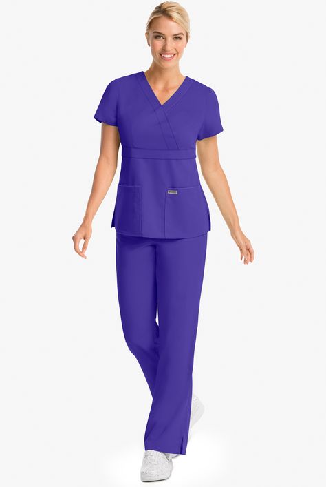 Have you ever seen a scrub top so elegant? Don t let this flattering fit fool you, it s also ultra-functional, designed to move with you, and made with durable-moisture wicking fabric. Inspired by the hit television show, our Grey s Anatomy™ by Barco classic scrubs collection features quality fabrics in both classic and modern silhouettes, for a fit and feel that s authentic to you. • Modern fit • V-neck • Mock wrap • Total of 3 pockets • 2 front pockets • 1 hidden pen pocket • Short sleeve • Em Top Uniform, Medical Scrubs Fashion, Pink Scrubs, Greys Anatomy Scrubs, Uniform Advantage, Scrub Jackets, Easy Stretches, Medical Scrubs, Scrub Tops