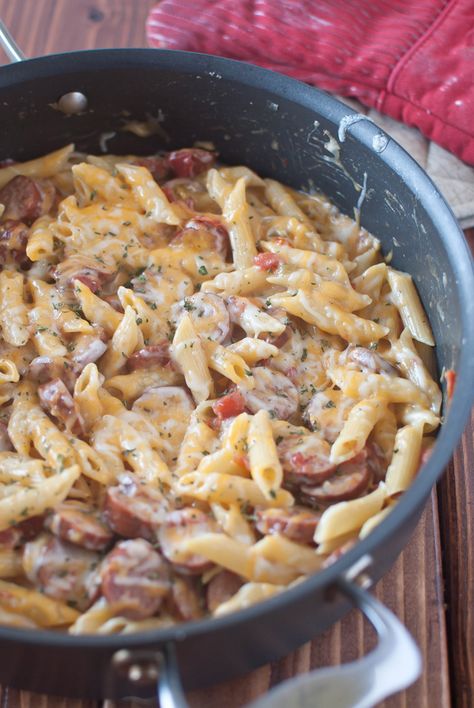 little bits: Sausage Pasta Skillet {recipe} I made this using leftover sausage links we grilled out and it was amazing! And so easy!! Sausage Pasta Skillet, Spicy Sausage Pasta, Pasta Skillet, Skillet Pasta, Spicy Sausage, Sausage Pasta, Skillet Meals, Bratwurst, One Pan