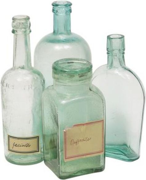 Vintage bottles look lovely on display in clusters on a table or reflecting the light on a windowsill, but authentic antique bottles can be difficult to find and expensive. Save time and money by making new bottles look vintage. You control how old and dirty you wish your bottles to be. Pick up plain bottles at thrift ... Vintage Bottles Decor, Old Glass Bottles, Antique Glass Bottles, Perfume Bottle Art, Green Glassware, Bottle Display, Antique Bottle, Lighted Wine Bottles, Antique Bottles