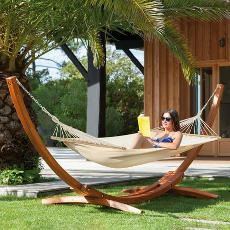 Do you still read a book just on the sofa at home? Do you still take a nap just on the lounge chair outdoors? AVAWING wooden hammock can satisfy you to enjoy a quiet leisure afternoon in your backyard or garden, whether it is in the shade of the tree, near the garden, backyard, or terrace. Relax, read a book, or just look at the clouds above your head. You can also use these wooden hammocks indoors as a permanent bed replacement for a deeper and more peaceful sleep. High Quality Hammock Large enough to accommodate 2 grown adults. Its designed to support up to 550 pounds. Made of polyester-cotton cloth that easily cleans up and dries quickly. Non-toxic fabric material, soft, breathable, and comfortable, weatherproof and oil proof, water resistant, and UV resistant. 14FT wood stand, the stur Backyard Yoga Space, Backyard Yoga, Indoor Hammock Bed, Cabin Patio, Wooden Hammock Stand, Wooden Hammock, Double Hammock With Stand, Hammock With Stand, Hammock Stands