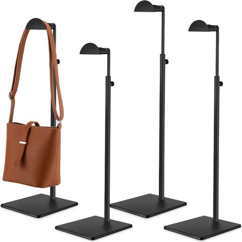 PRICES MAY VARY. Black Stands: you will receive 4 polished black purse display stands, it's durable, no fading black finish that looks very textured and allows you to display or store bags you can hang at home or in the store, Looks elegant and very neat Strong and Durable: our metal hanger display stands are made of sturdy, rust free stainless steel with a thick, weighted, stable base and semi circular hooks to hang your handbags securely, you don't have to worry about his quality Adjustable He Boutique Counter, Purse Display, Handbag Display, Store Boutique, Bag Rack, Bag Display, Jewelry Display Stands, Display Stands, Bag Stand