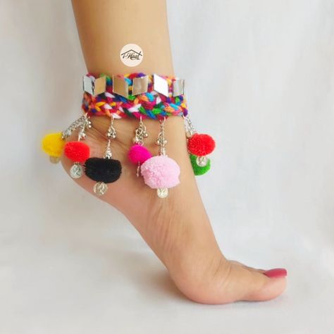 Are you shopping for your navratri look in advance? If yes, checkout these beautiful boho anklets Adorned with lots of mirrors, ghungroo and Multicolored pom poms🔥 These Multicolored boho anklets are perfect to match your garba vibes for this Navratri Season ❤️ Visit indiashaat.com for more handmade jewellery items #indiashaat #multicolorjewellery #bohojewelry #anklets #navratrijewellery #sajni [Handmade jewellery, navratri jewellery, Multicolored jewellery, unique jewellery, trendin... Unique Navratri Outfits Ideas, Garba Jwellery, Navratri Look, Canvas Shoes Diy, Navratri Jewellery, Navratri Collection, Kutch Work Designs, Diy Fabric Jewellery, Fabric Jewellery