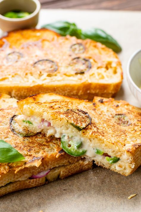 This Vegan Jalapeño Popper Grilled Cheese is the ultimate comfort food. Coated in vegan parmesan and filled with spicy jalapeños & red onion | ThisSavoryVegan.com #thissavoryvegan #vegangrilledcheese #vegansandwich Vegan Grilled Cheese Sandwich, Easy Vegetarian Sandwiches, Vegan Bbq Food, Vegetarian Comfort Food Recipes, Vegan Picnic Food, Rainbow Rangoli, Popper Grilled Cheese, Vegan Snacks On The Go, Vegan Jalapeno Poppers