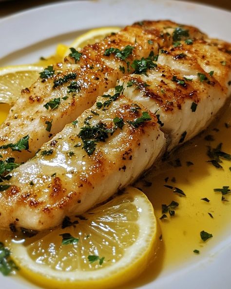 Zesty Lemon Butter Fish Fillet 🍋🐟 Ingredients: - 4 fish fillets (such as cod, tilapia, or haddock) - 3 tablespoons unsalted butter, melted - 2 tablespoons olive oil - 2 tablespoons lemon juice - 2 cloves garlic, minced - 1 teaspoon lemon zest - Salt and pepper to taste - Fresh parsley, chopped (for garnish) - Lemon slices (for garnish) Instructions: 1. Preheat the oven to 375°F (190°C). Line a baking sheet with parchment paper. 2. In a small bowl, combine melted butter, olive oil, lemon j... Garlic Butter Oven Baked Tilapia, Lemon Butter Garlic Fish, Fish Fillet With Lemon Butter Sauce, Lemon Garlic Tilapia, Fancy Seafood, Food Art Ideas, Zesty Lemon Butter Fish Fillet, Butter Fish, Seafood Feast