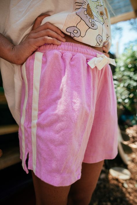 Let's keep this short and sweet – these shorts are the bomb. Inspired by the groove of the 70's- they're made of 100% cotton, with a sporty stripe on the side, an elasticated waist with drawstring, and two side slits to add even more swing to your step. We think these shorts are perfect for anytime of the day or night and are so excited to be sharing them with you! Team them with any of out tee's for a steeze inspired by passed times. Best Beach Chair, Terry Towelling, Beach Tent, Short And Sweet, The Bomb, Fleece Shorts, Back Women, Gym Wear, Fun Bags