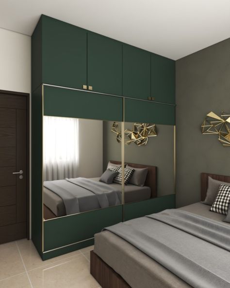 A swathe of dark green on the lower and upper cabinets gives a pleasant vibe to this all-white design.#kitchen #kitchendesign #interiordesign #homedecor #design #interior #kitchendecor #homedesign #homesweethome #renovation #bedroom #kitchenremodel #kitcheninspo #kitchenrenovation #interiordesignerbangalore #luxurykitchen #kitchenwardrobe #tallunit Dark Green Wardrobe Bedroom, Green Cupboards Bedroom, Green Wardrobe Bedroom, Cupboard For Bedroom, Latest Cupboard Designs, Green Wardrobe, Renovation Bedroom, Almirah Designs, Green Color Combinations