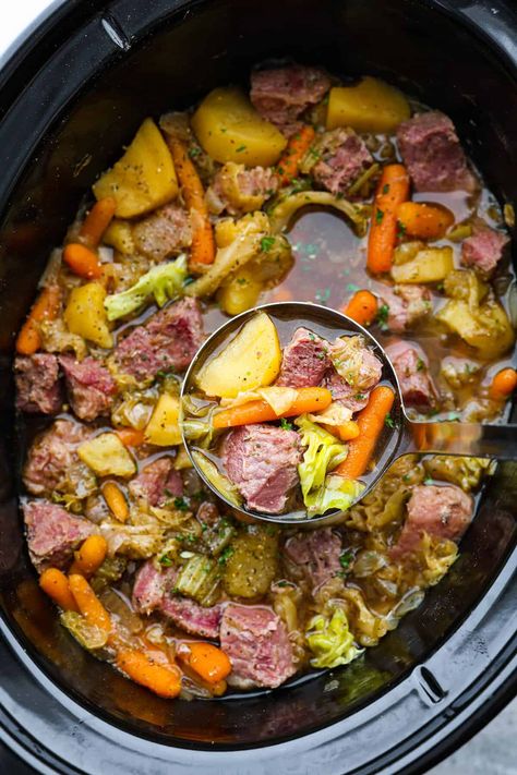 Corned Beef and Cabbage slow cook all day with hearty vegetables making one delicious stew! This is a classic recipe with nostalgic flavors, and it's so easy to whip up. Corned Beef And Cabbage Stew, Corned Beef Stew, Corned Beef Soup, Stew Slow Cooker, Cabbage Stew, Slow Cooker Corned Beef, Corn Beef, Corned Beef And Cabbage, Beef And Cabbage