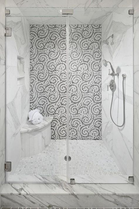 A seamless glass walk-in shower boasts a curved marble shower bench fixed on marble grid floor tiles beneath a tiled niche framed by a marble surround. Marble Shower Bench, Corner Shower Seat, Tile Accent Wall, Small Shower Remodel, Marble Showers, Shower Seat, Shower Bench, Shower Niche, Bathroom Shower Tile