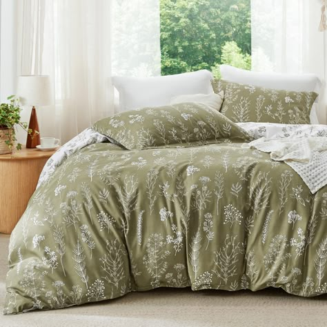 PRICES MAY VARY. Unique Reversible Design: This floral comforter set is reversible with contrasting colors. Simply flip the comforter or the pillow shams over to refresh your interior decor. The vivid floral and tree branch patterns add an elegant touch and a botanical vibe to your sleeping space. Optimal Comfort: Featuring Bedsure's thoroughly tested, high-grade down alternative filling blend to provide right warmth while ensuring optimal support, this polyester microfiber comforter set offers Botanical Bedding Sets, Unique Comforter Sets, Forestcore Bedding, Olive Green Boho Bedroom, Dark Floral Bedding, Cute Comforter Sets, Bedroom Decor Sage Green, Olive Green Comforter, Full Size Bed Sheets