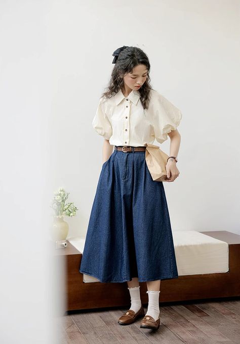 Add a touch of vintage and retro vibe to your outfit. This midi length denim skirt has a button and zip up front, pleats, side pockets, belt loops and elastic back. 24"-34" waist, 30" length Button Jean Skirt Outfit, Skirts Mid Length, Denim Maxi Skirt Autumn, Midi Skirt Outfit Vintage, Skirt Outfits Semi Formal, Denim Tiered Skirt Outfit, Ootd Warna Denim, Long Skirt Outfits Classy, Dark Blue Outfits Aesthetic