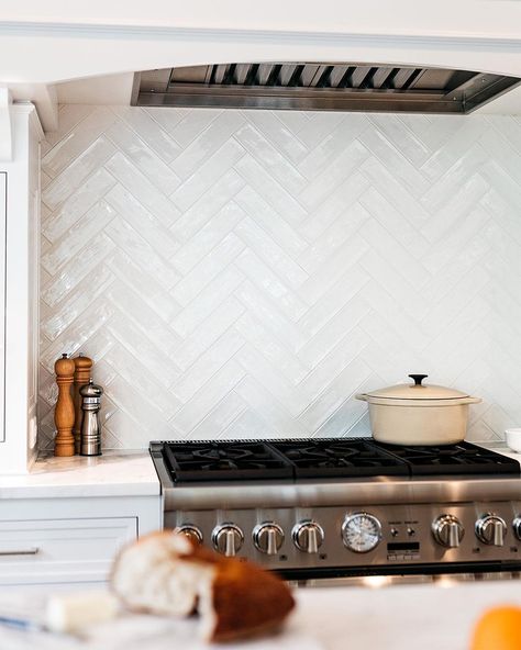 Double Herringbone Backsplash Kitchen, White Brick Herringbone Backsplash, Light Blue Herringbone Backsplash, White Kitchen With Herringbone Tile, Fishbone Backsplash Kitchen, Herringbone Above Stove, Chevron Backsplash Kitchen Herringbone, Statement Backsplash Behind Stove, Herringbone Tile Kitchen Backsplash