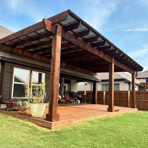 I just finished up this SkyPoly Pergola in Ponder. 28x14. 8x8 posts. 4x12 header. 2x8 joists. 2x4 slats. We lifted off the roof with the SkyLift Roof Risers. We installed the SkyPoly roof. Notched joists. 2’ overhang. We also did the stamped concrete wood texture under the pergola. Text me Chad the tall goofy guy if you want a pergola. 972-342-1645 #pergola #patiocover #pergoladesign #patiodesign #outdoorlivingspace #outdoorlivingroom Pergola Attached To House With Roof, Skylift Roof Riser, Stained Pergola, Skypoly Pergola, Cabin Hot Tub, Carport Designs, Wood Pergola, Pergola Attached To House, Wooden Pergola