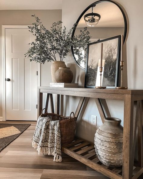 24+ Creative Fall Entryway Decor Inspirations (& Tips) - DrExplains Foyer Table With Round Mirror, Entryway Lamps Foyer Tables, Jungle Entryway, Mirror Hallway Entrance, Cozy Entryway Ideas, Round Mirror Entryway, Entrance Way Ideas, Round Mirror Decor Ideas, Styling Entryway